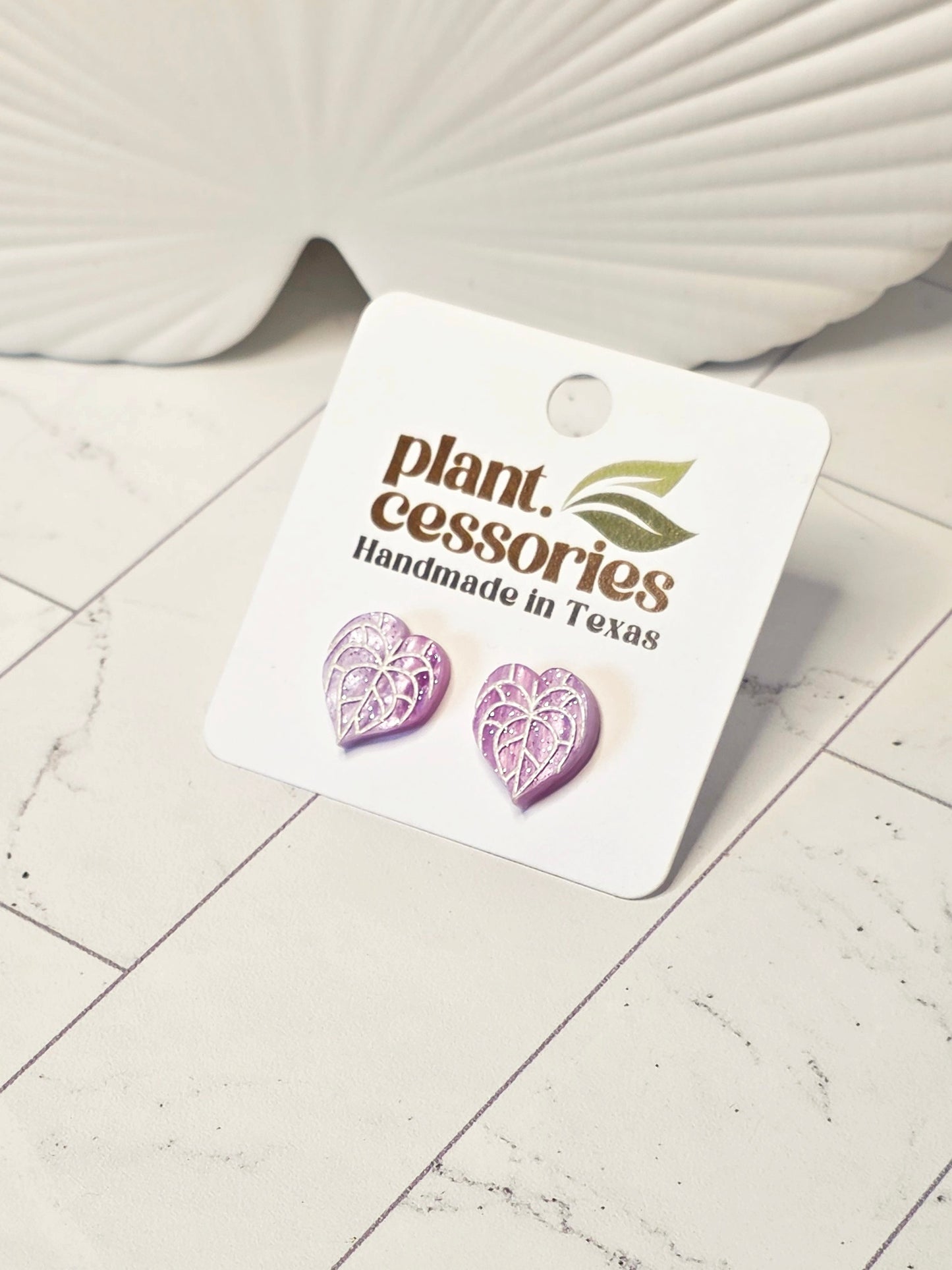 Lilac sparkle anthurium stud earrings made from galaxy acrylic with hypoallergenic stainless steel posts.