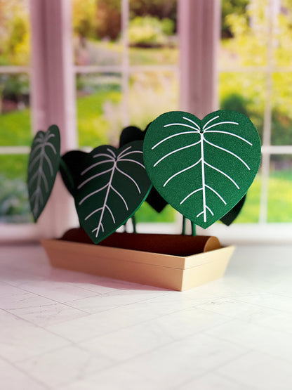 3D-printed Philodendron plowmanii coaster set with secret compartment displayed assembled as a decorative plant with detachable leaf coasters.