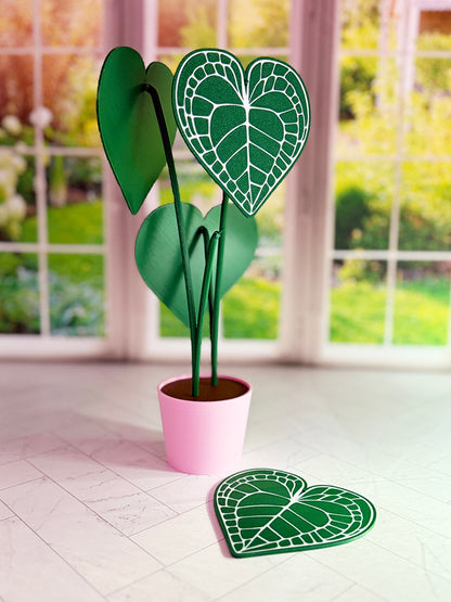 3D-printed Anthurium Clarinervium coaster set with hidden compartment displayed as a decorative plant with detachable heart-shaped leaf coasters.