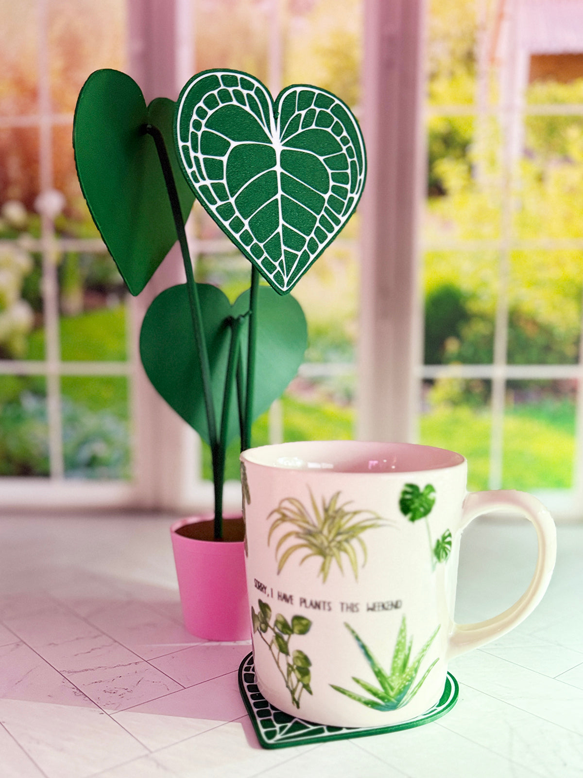 3D-printed Anthurium Clarinervium coaster set with hidden compartment displayed as a decorative plant with detachable heart-shaped leaf coasters.