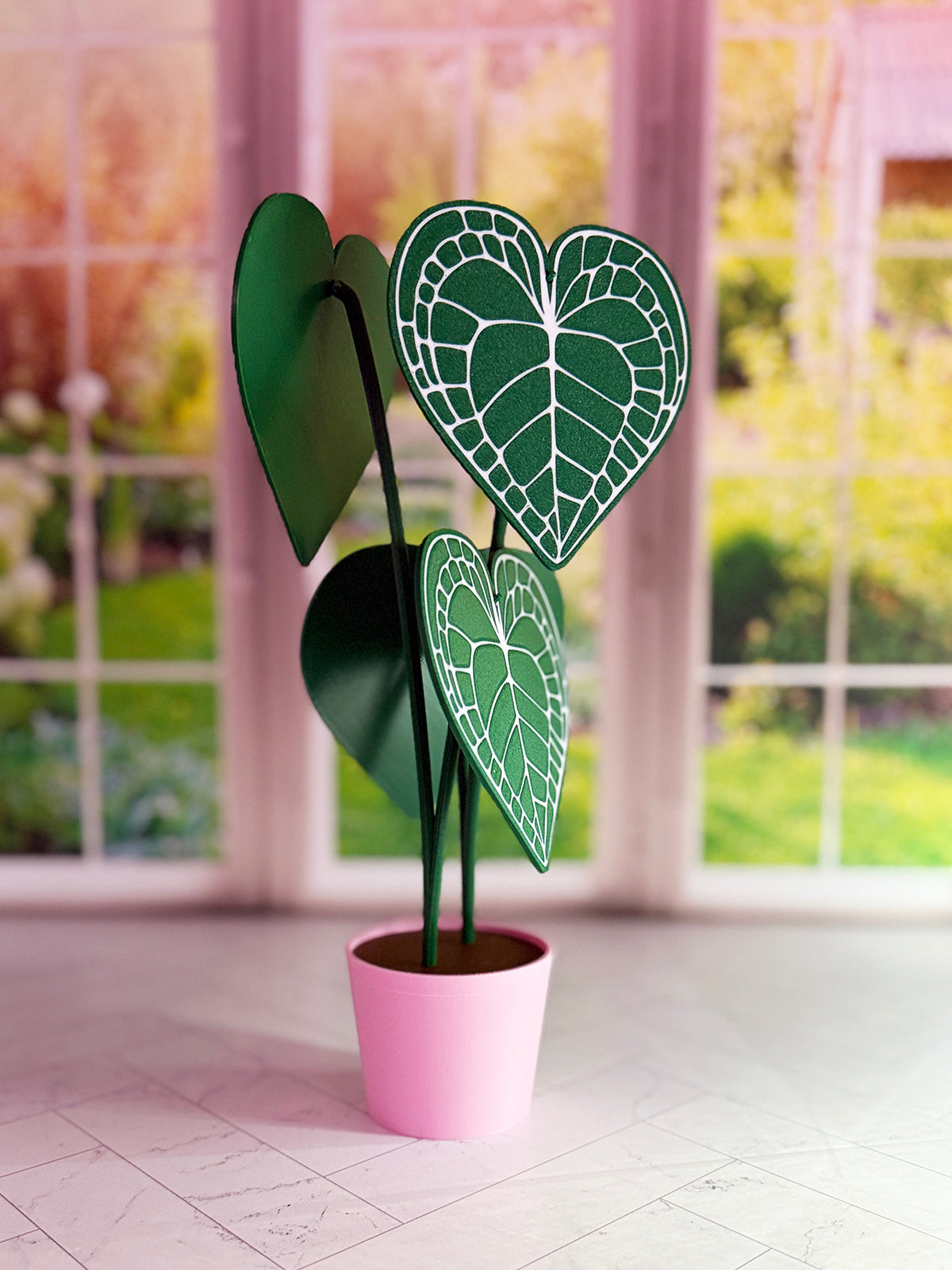 3D-printed Anthurium Clarinervium coaster set with hidden compartment displayed as a decorative plant with detachable heart-shaped leaf coasters.