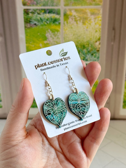 Galaxy green Anthurium clarinervium leaf earrings with hand-painted white vein details.