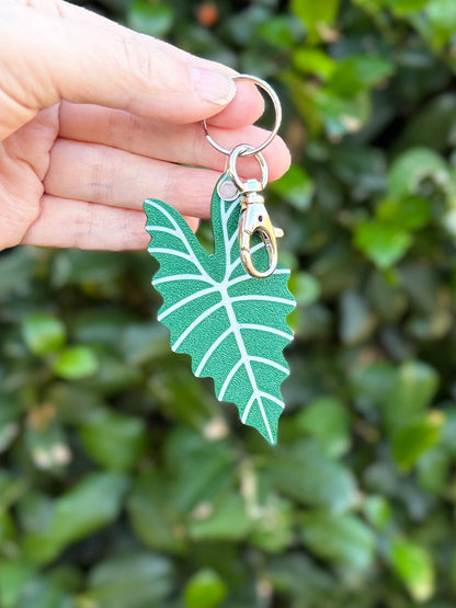 Green and pink Alocasia Amazonica leaf keychains and bag charms 3D printed from plant-based PLA.