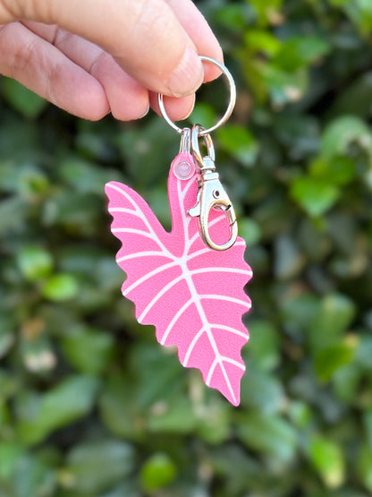 Green and pink Alocasia Amazonica leaf keychains and bag charms 3D printed from plant-based PLA.