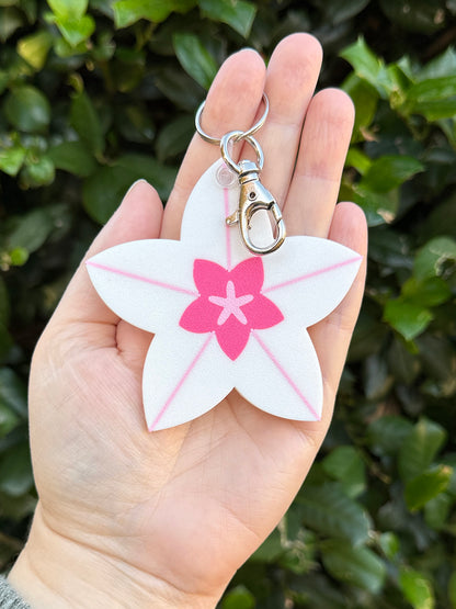 Hoya bloom keychain clipped to metal keyring and lobster clasp.