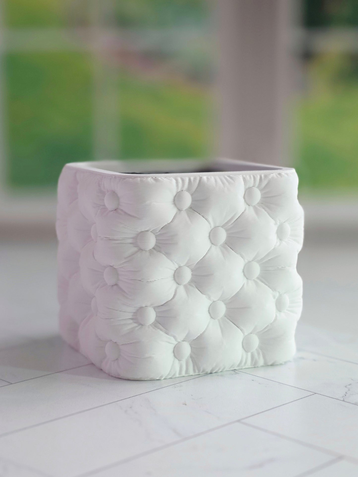 Tufted cube planter with a soft button-tufted texture and modern square shape, designed to fit a 2 inch square nursery pot