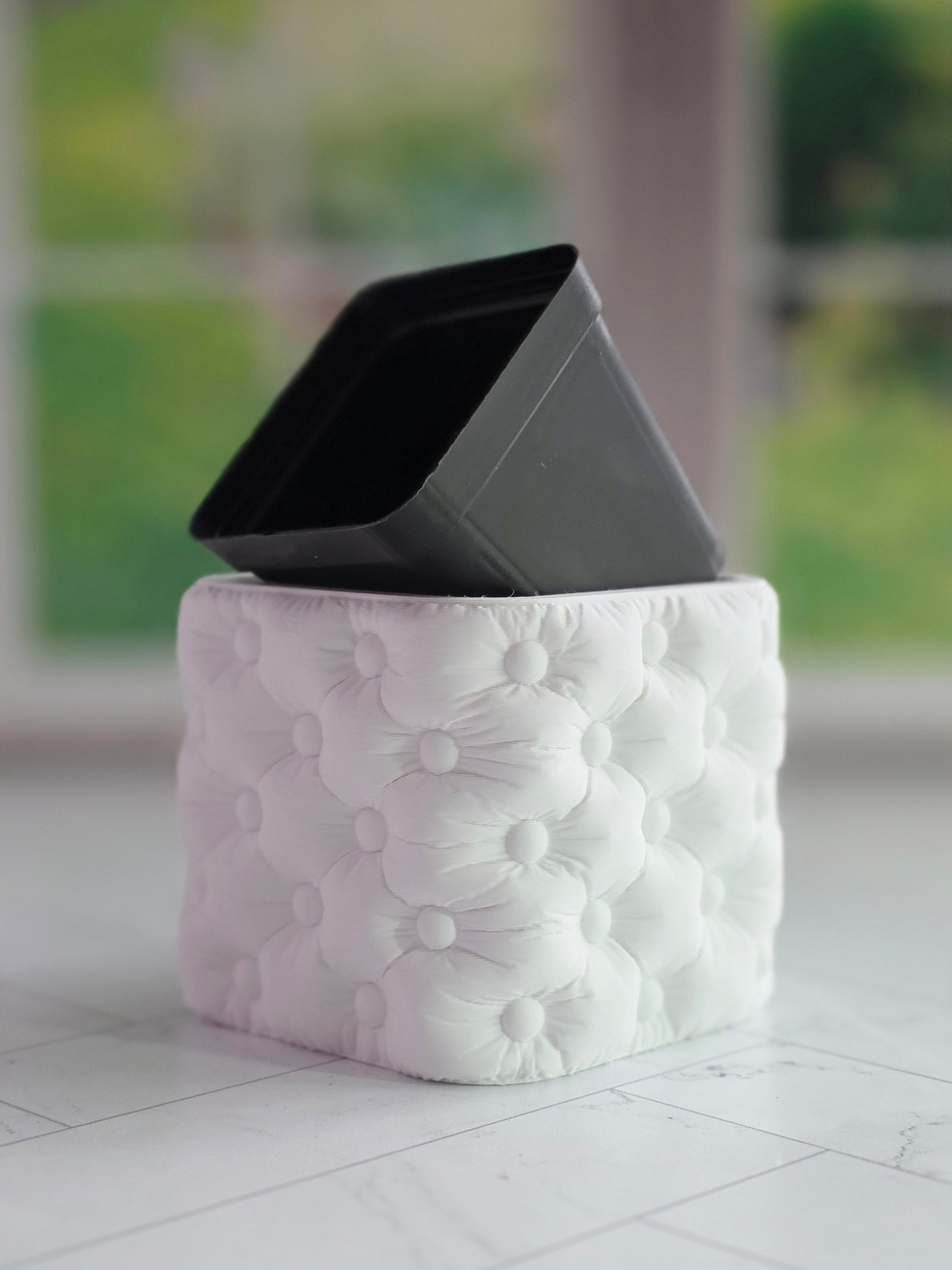 Tufted cube planter with a soft button-tufted texture and modern square shape, designed to fit a 2 inch square nursery pot