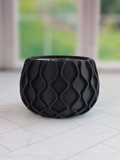Mod wave planter with flowing textured ridges and a modern round shape, designed to fit a 2.5 inch round nursery pot