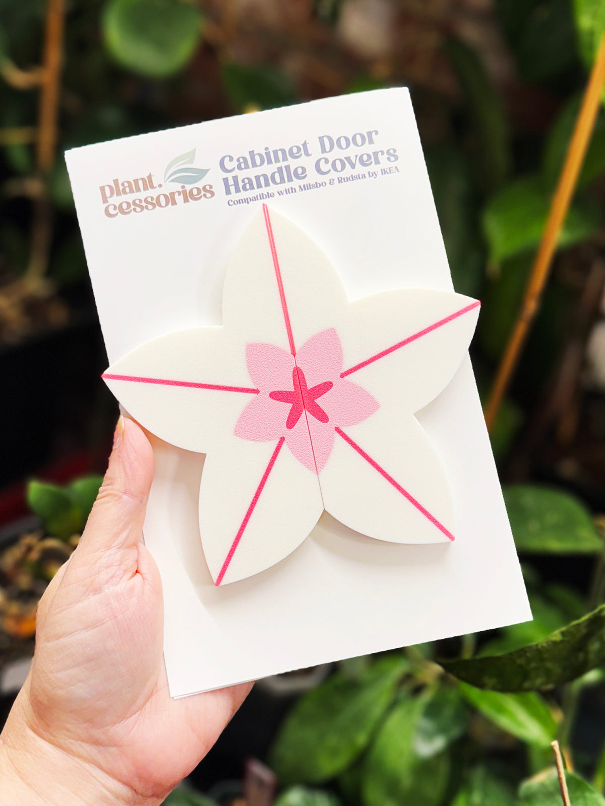 Set of slip-on hoya flower handle covers designed for IKEA greenhouse cabinet handles.