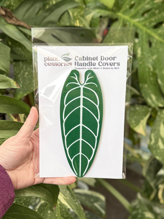 Slip-on Anthurium warocqueanum handle covers designed for IKEA Milsbo and Rudsta greenhouse cabinets.